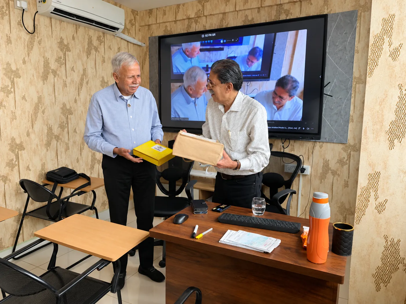 Faculty exchanging mementos at Vajra Aviation